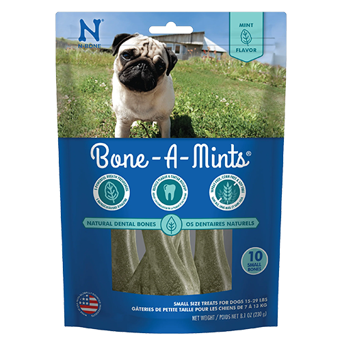 Package of Bone-A-Mints dog treats with a pug on the grass
