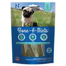 Package of Bone-A-Mints dog treats with a pug on the grass