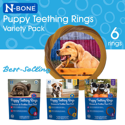 N-Bone Puppy Teething Rings Variety Pack with a dog chewing on a ring, against a blue background with circular patterns.