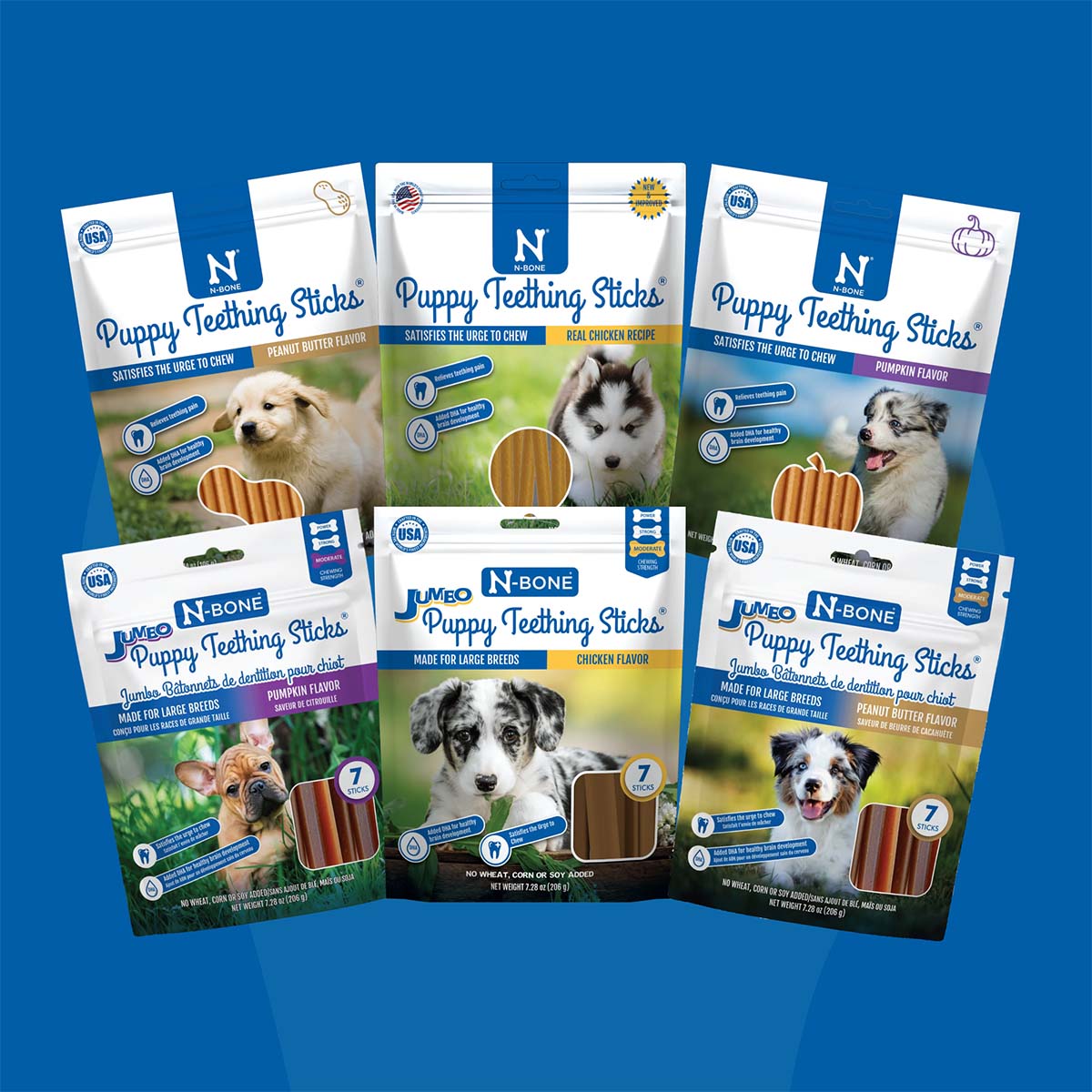 Multiple packages of N-Bone Puppy Teething Sticks on a blue background